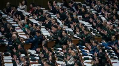Делегаты на III пленарном заседании Всекитайского собрания народных представителей в Большом зале народных собраний в Пекине 12 марта 2019 года. (Kevin Frayer/Getty Images)
