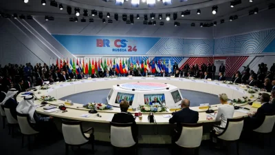 Президент России Владимир Путин выступает с речью на расширенном заседании саммита БРИКС в Казани, Россия, 23 октября 2024 года. (Alexander Nemenov/Pool/AFP via Getty Images)