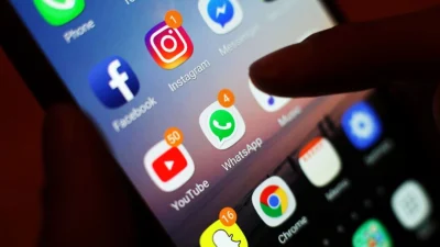 Иконки приложений социальных сетей на экране телефона 3 января 2018 года. (Yui Mok/PA)