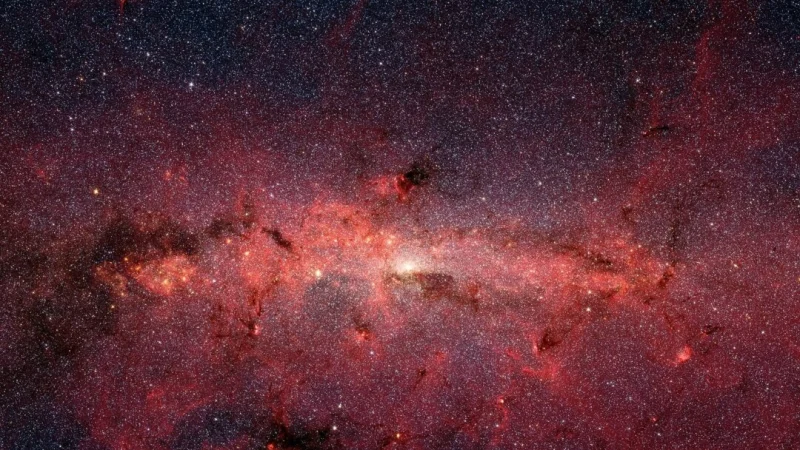 На этом инфракрасном снимке, сделанном космическим телескопом Spitzer, видно бесчисленное множество звезд, составляющих спираль галактики Млечный Путь. (Public Domain)